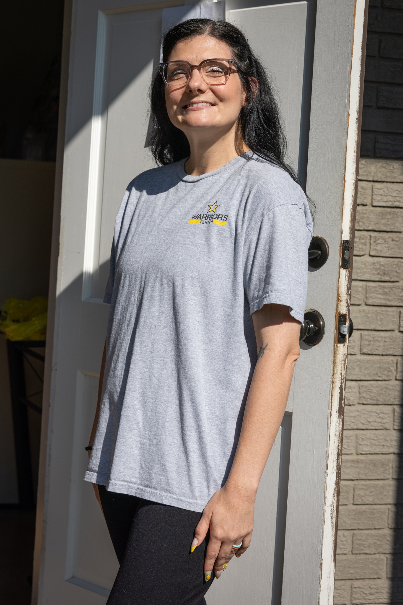 Angelina McClain in the doorway at the Warriors Center Olive Branch campus