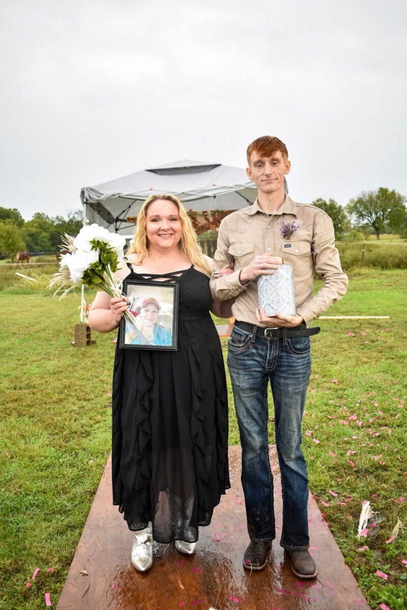 Adrianna at her brother’s wedding, carrying a photo in honor of their mother