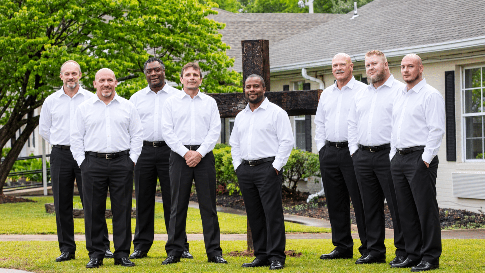 Uniform mockup of a Warriors Center group in white shirts and black pants.