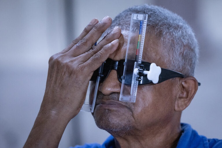 A man having his eyes tested at a vision clinic in Honduras